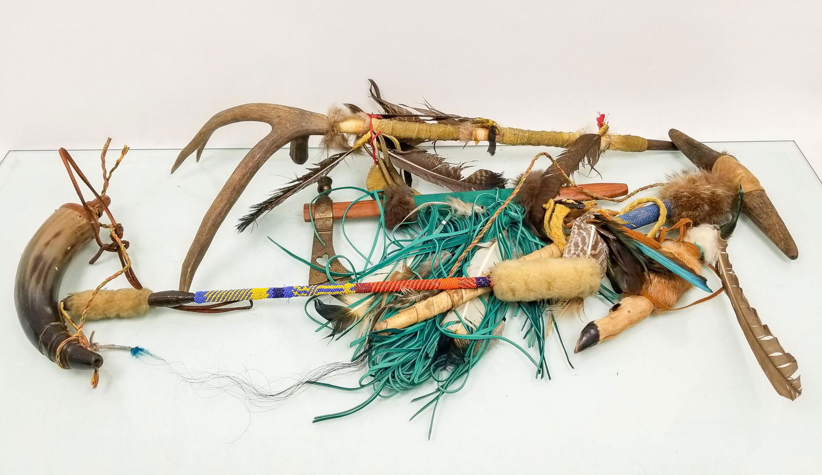 Native American Weapons and Tools: Native American Weapons and Tools: engraved metal axe - beaded dance stick - pipe carved from antler - and more Literature Brooks Auction is not responsible for outbids. Questions? Call the office at