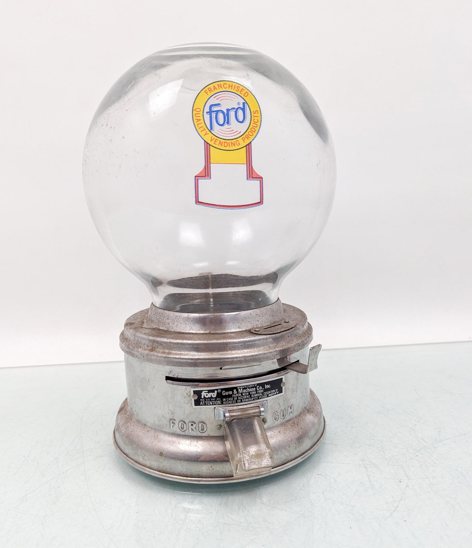 Vintage Ford Gum & Machine Co. Gumball Machine: Vintage Ford Gum & Machine Co. Gumball Machine, constructed from metal and glass Size 12"H Literature Brooks Auction is not responsible for outbids. Questions? Call the office at (856) 694-2960 or e
