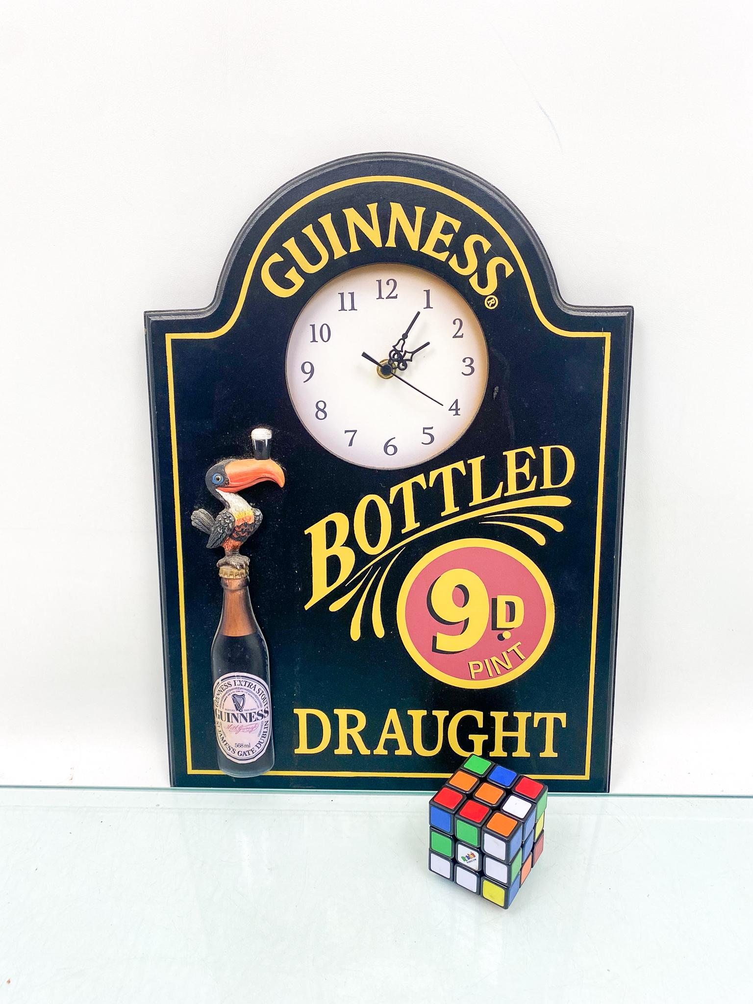 Guinness Wooden Advertising Clock: Guinness Wooden Advertising Clock Size 18" x 13" Literature Brooks Auction is not responsible for outbids. Questions? Call the office at (856) 694-2960 or email us directly at info@brooks.auction.