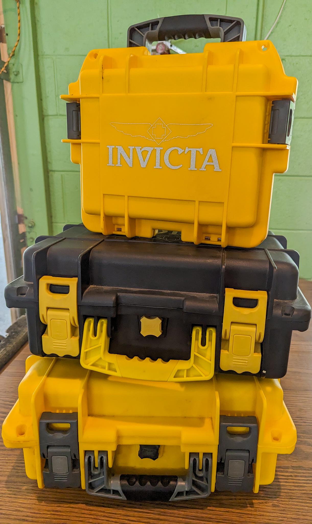 Three Invicta Watch Cases: Three Invicta Impact Yellow Dive Collector Box Cases: (2) Eight Slots - (1) Three Slots Literature Brooks Auction is not responsible for outbids. Questions? Call the office at (856) 694-2960 or email