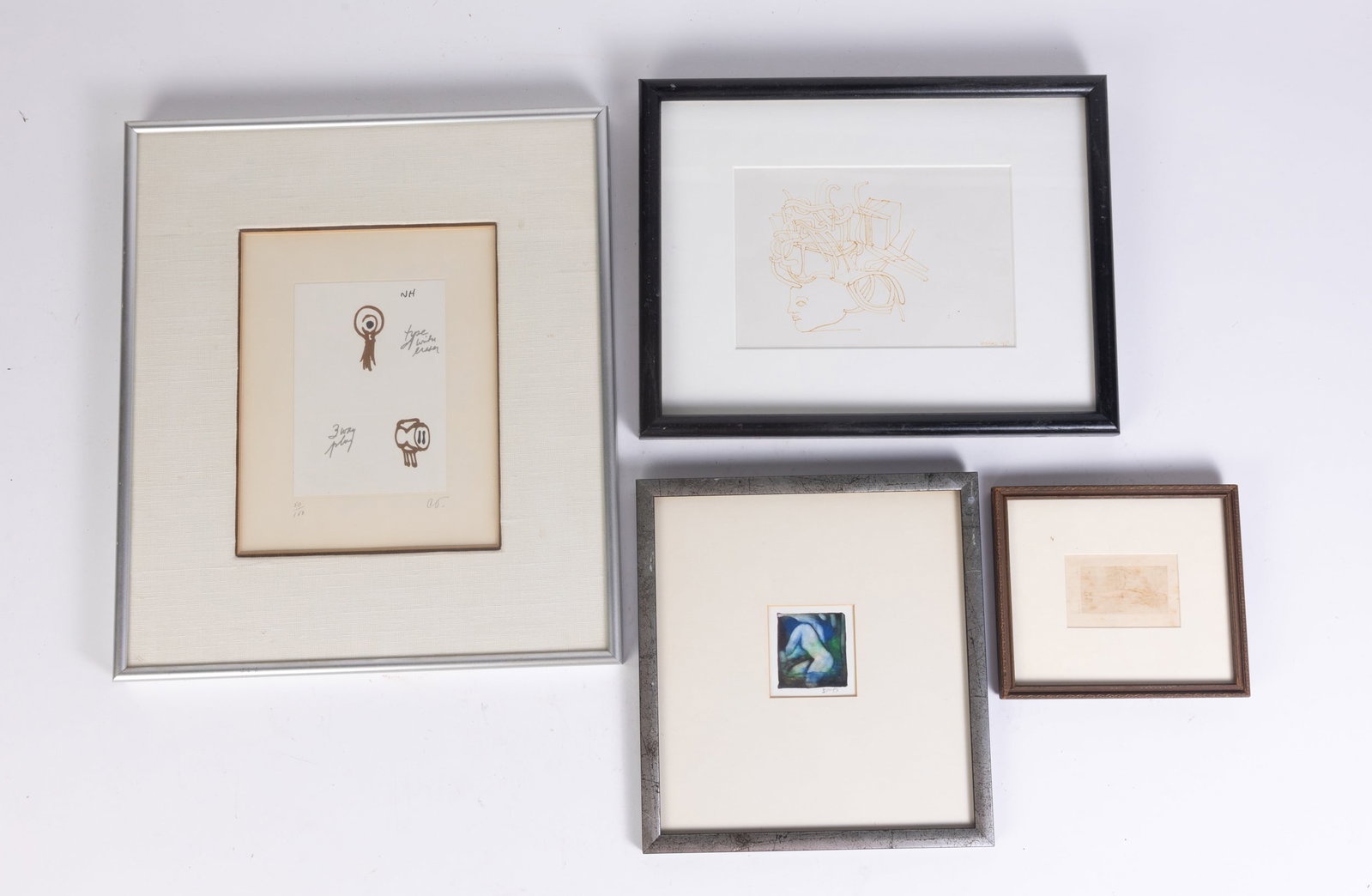 Four Framed Pieces of Wall Decor: Four Framed Pieces of Wall Decor: small print of a nude woman signed "Mitchell" numbered 19/36 - abstract painting of a nude woman, signed - "Type with Eraser", "Three Way Plug" signed print - signed 