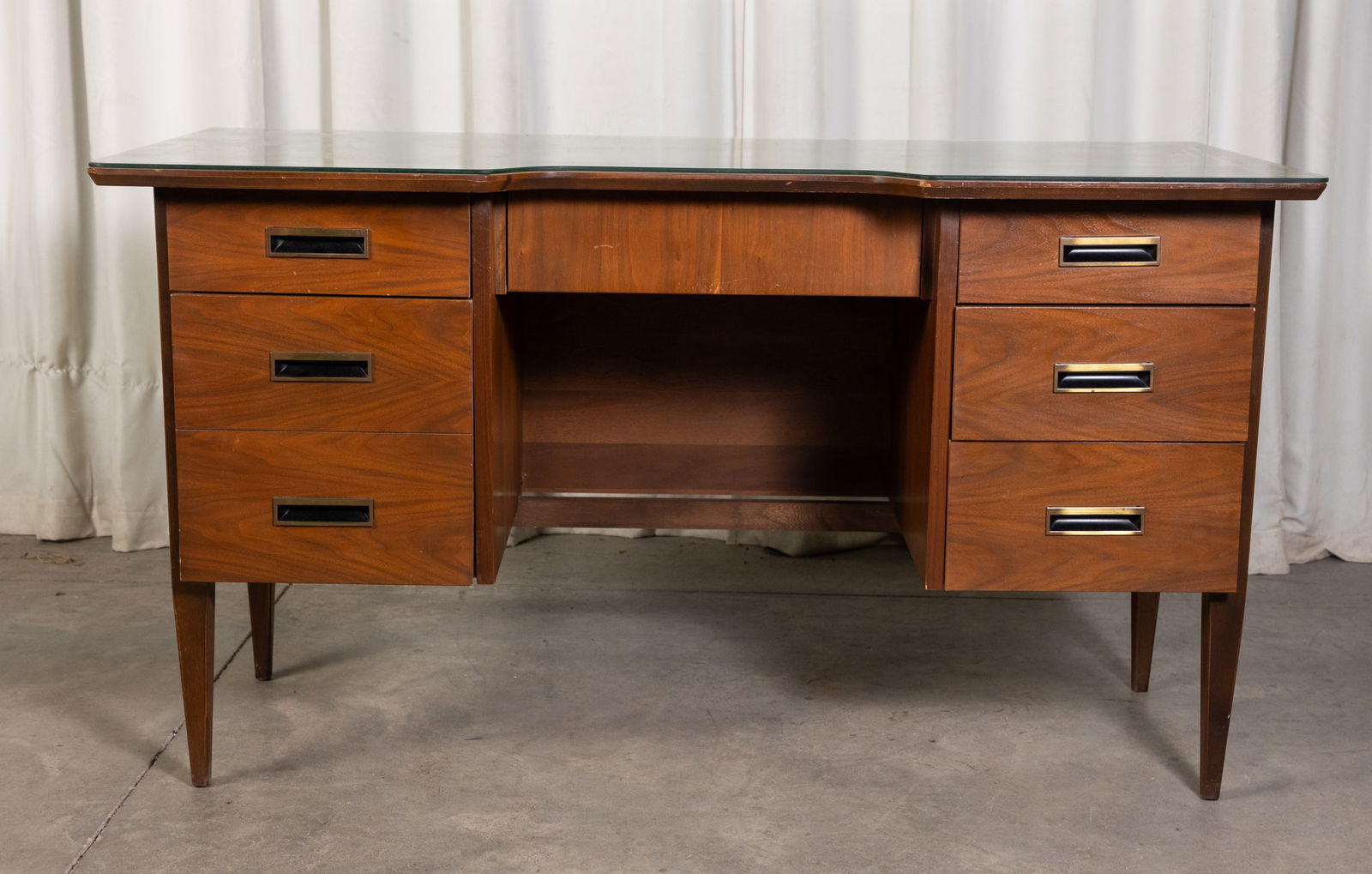 Mid Century Modern MCM Teak Desk with Custom Glass Top: Mid Century Modern MCM Teak Desk with Custom Glass Top, sold by J. B. Van Sciver, dovetailed construction Size 30" x 53" x 25" Literature Brooks Auction is not responsible for outbids. Questions? Ca