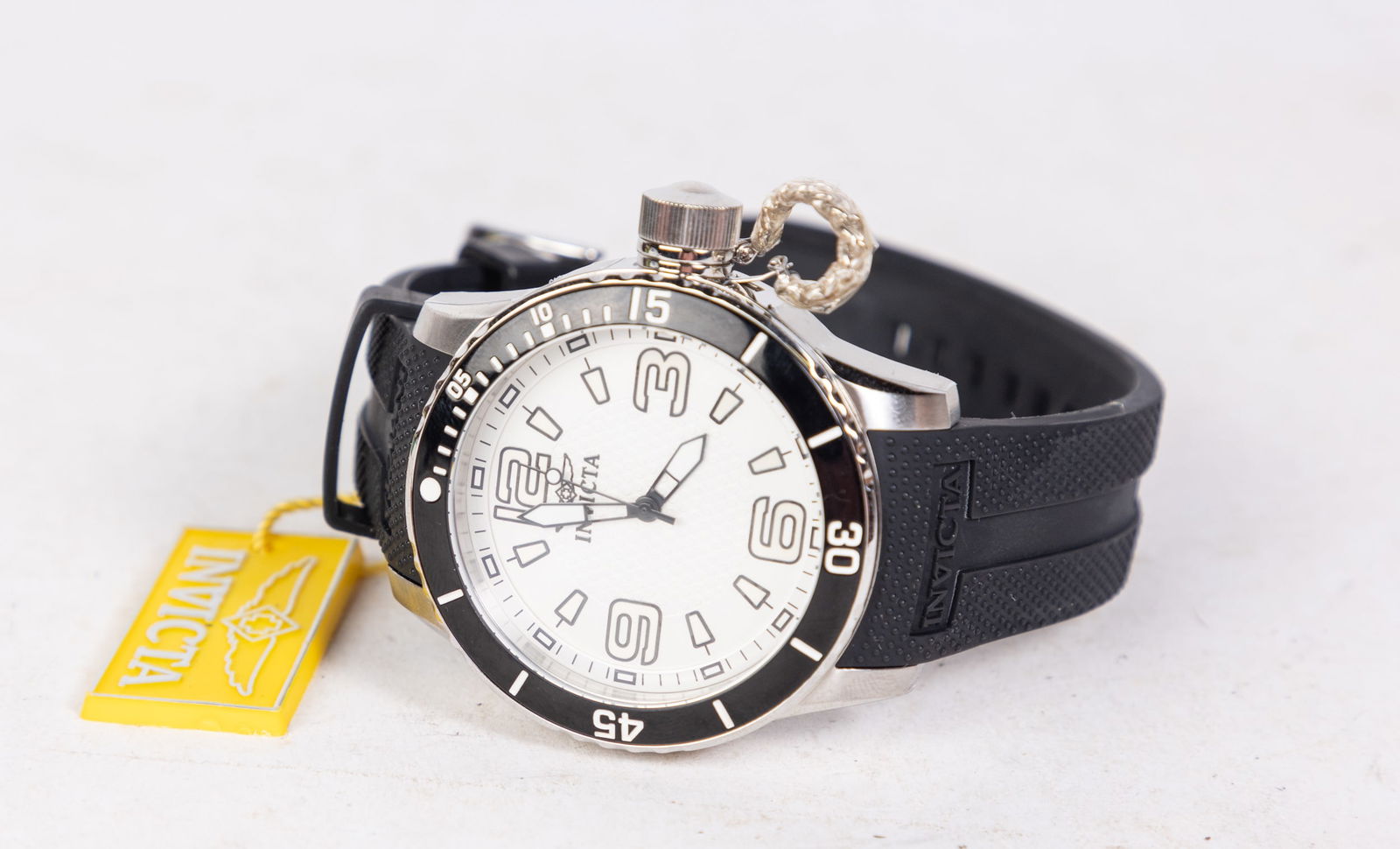 Invicta Specialty Men's Watch: Invicta Specialty Men's Watch model #1669, stainless steel with polyurethane band, Swiss Quartz movement, 100m water resistance Size 6" x 6" x 6" Literature Brooks Auction is not responsible for outb