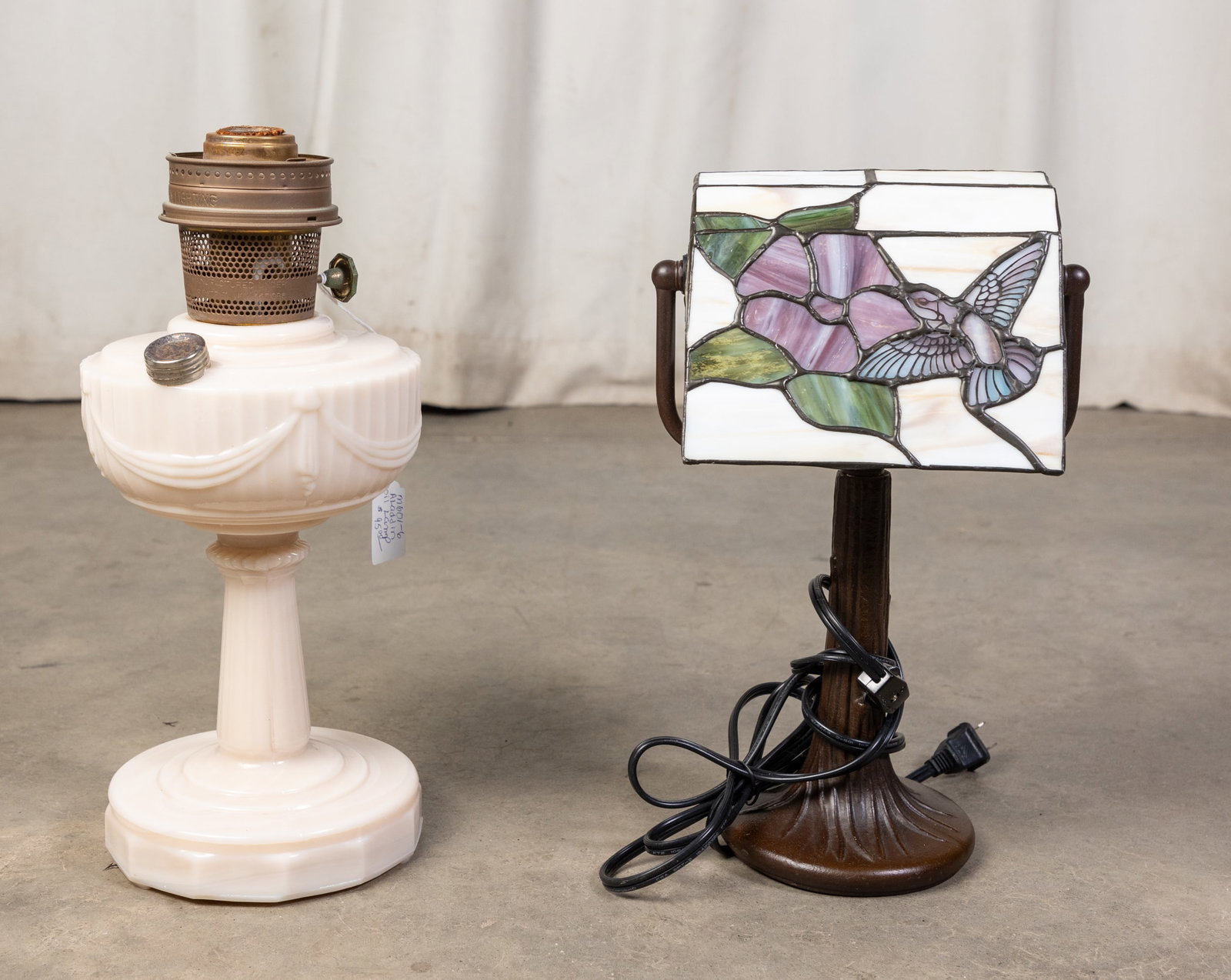 Two Vintage Lamps: Two Vintage Lamps: antique milk glass oil lamp - leaded slag glass desk lamp Size 28" x 7" Literature Brooks Auction is not responsible for outbids. Questions? Call the office at (856) 694-2960 or e