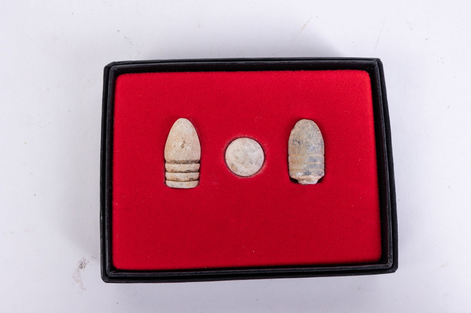 Three Civil War Bullets in display case (1 of 2)