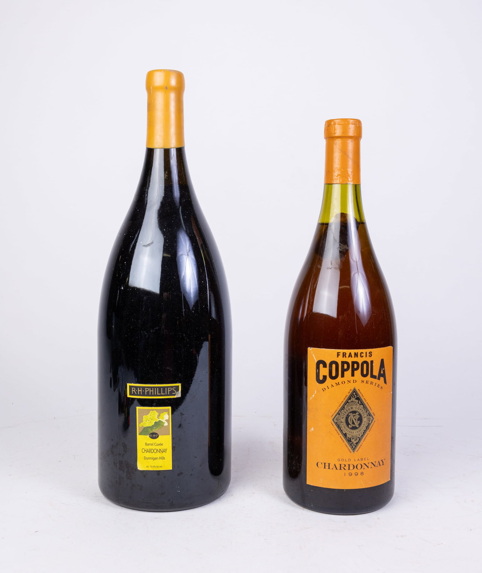 Two Decorative Magnum Wine Bottles: (2) Decorative Magnum Wine Bottles Size 20"h (larger) Literature Brooks Auction is not responsible for outbids. Questions? Call the office at (856) 694-2960 or email us directly at info@brooks.aucti