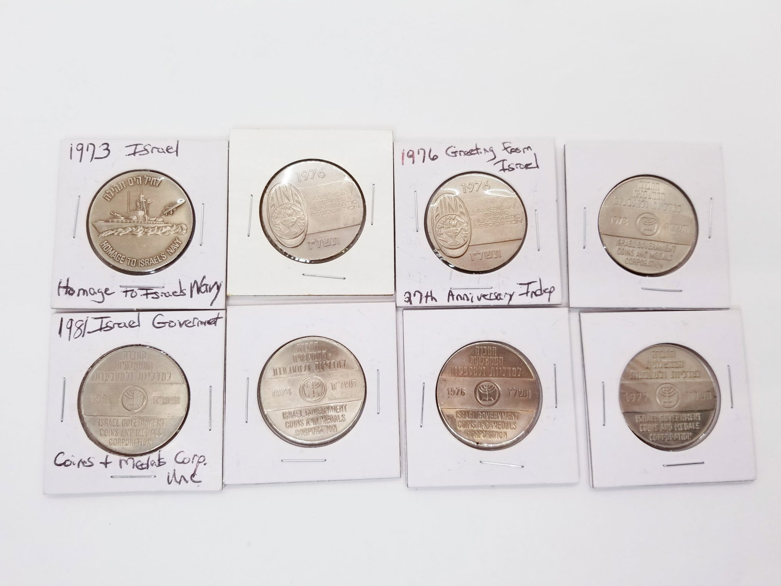 Eight Uncirculated Israel Government Coins & Medals: (8) Uncirculated Israel Government Coins & Medals: varying years and conditions, Homage to Israel's Navy, Coins & Medals Corp, 27th Anniversary Literature Brooks Auction is not responsible for outbids