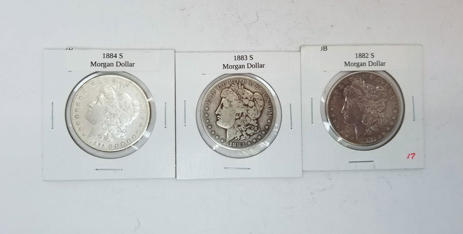 Three Morgan Silver Dollars (1 of 2)