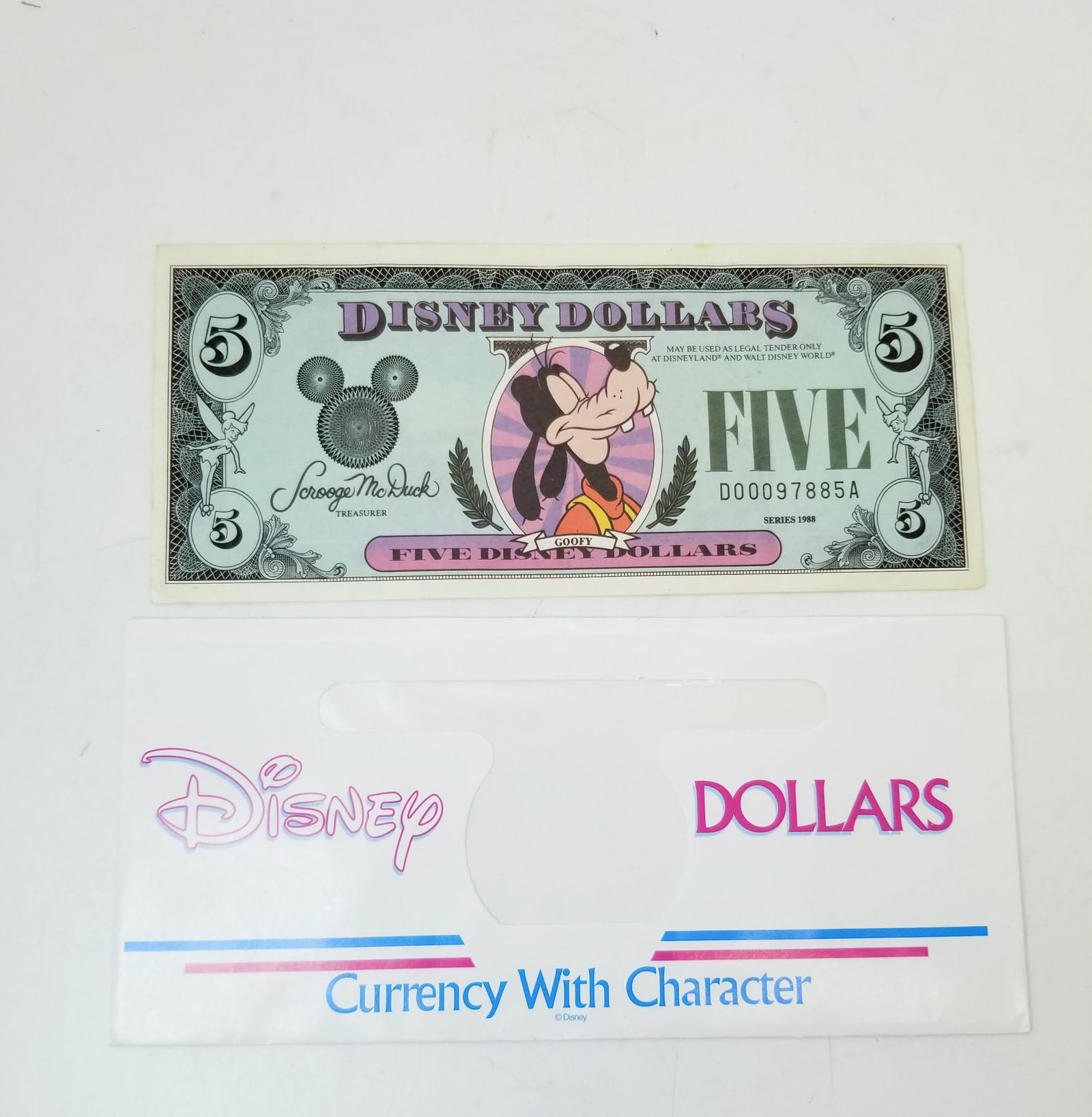 1988D Disney Five Dollar Closed Eyed Goofy: Disney Five Dollar Closed Eyed Goofy, series 1988D, used, with character envelope Literature Brooks Auction is not responsible for outbids. Questions? Call the office at (856) 694-2960 or email us dir