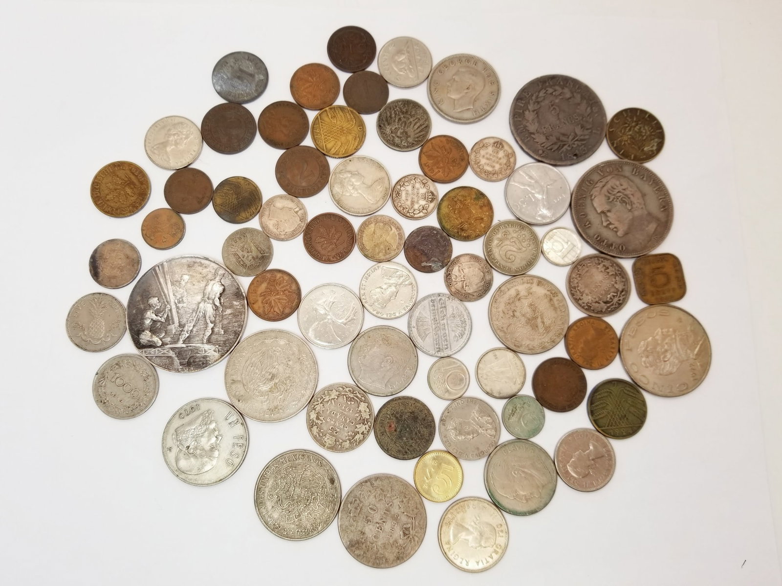 Foreign Coins: Foreign Coins, varying in conditions and years: Germany, Mexico, Great Britain, France, and more Literature Brooks Auction is not responsible for outbids. Questions? Call the office at (856) 694-2960 
