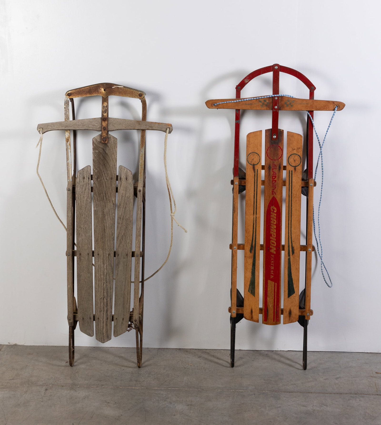 Two Vintage Sleds: Two Vintage Sleds: unbranded vintage sled - Gladding Champion Fastback Size 51" x 21" x 7" Literature Brooks Auction is not responsible for outbids. Questions? Call the office at (856) 694-2960 or e