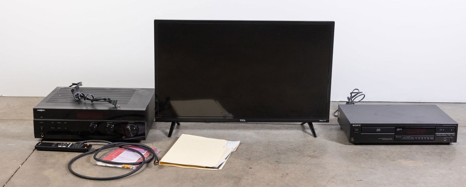 TCL Roku Flat Screen TV and Assorted Electronics: TCL Roku Flat Screen TV and Assorted Electronics Size 20" x 29" Literature Brooks Auction is not responsible for outbids. Questions? Call the office at (856) 694-2960 or email us directly at info@br