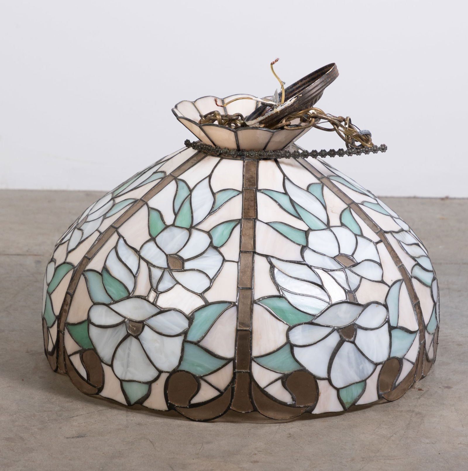 Leaded Slag Glass Hanging Light Fixture with Floral Motif: Leaded Slag Glass Hanging Light Fixture with Floral Motif Size 13" x 19" x 19" Literature Brooks Auction is not responsible for outbids. Questions? Call the office at (856) 694-2960 or email us dire