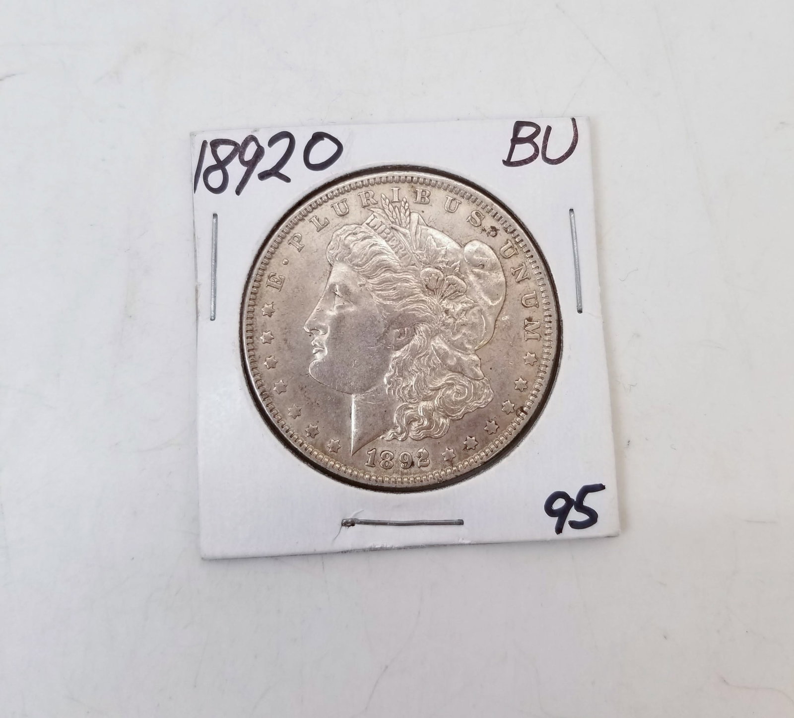 1892O Morgan Dollar: 1892O Morgan Dollar, BU Literature Brooks Auction is not responsible for outbids. Questions? Call the office at (856) 694-2960 or email us directly at info@brooks.auction. • Please read descript