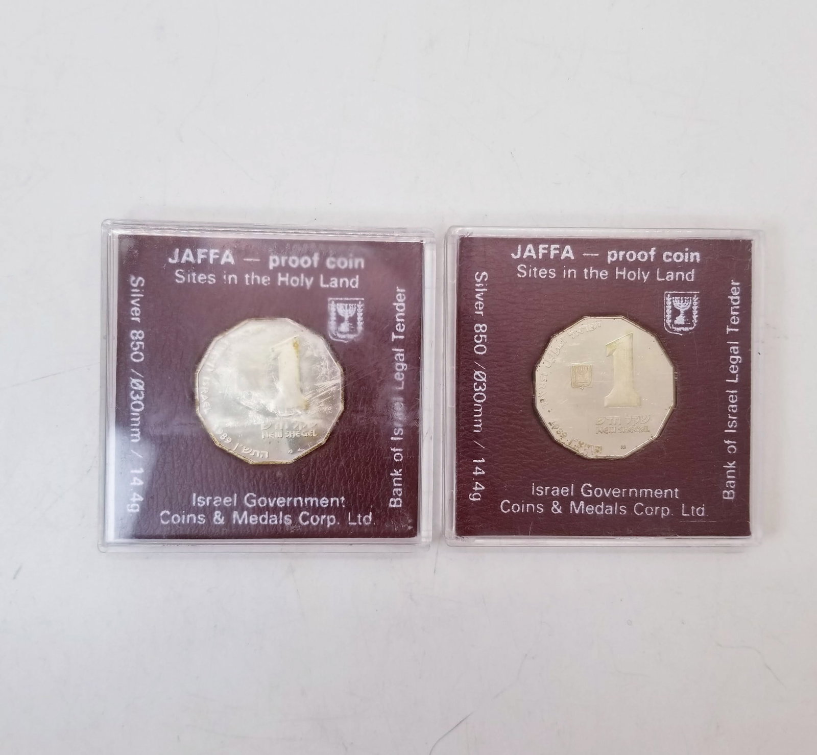Two 1 New Sheqel Israeli Coins: (2) 1 New Sheqel Israeli Coins, .850 Silver Literature Brooks Auction is not responsible for outbids. Questions? Call the office at (856) 694-2960 or email us directly at info@brooks.auction. • 