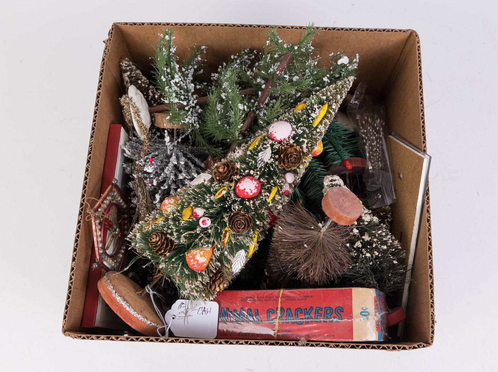 Lot of Vintage & Antique Christmas Decorations: Lot of Vintage & Antique Christmas Decorations, mostly vintage trees, some garland and ornaments Size 7" x 12" x 12" Literature Brooks Auction is not responsible for outbids. Questions? Call the off