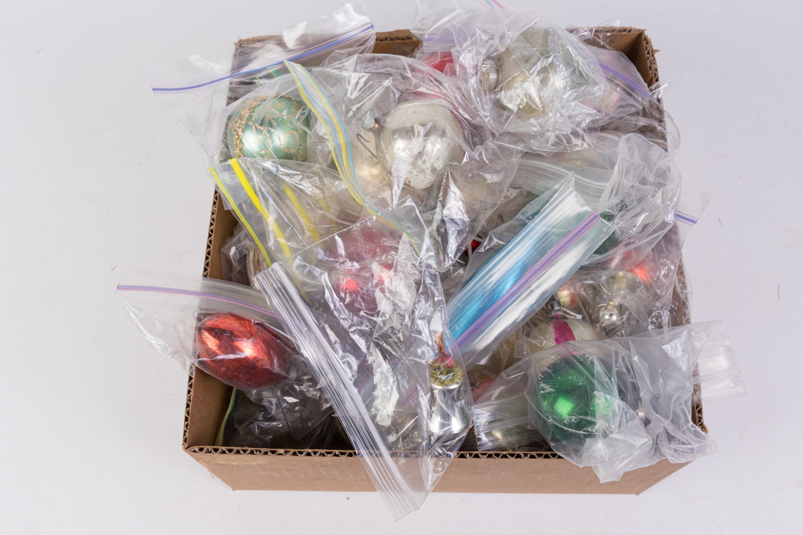 Lot of Vintage & Antique Christmas Decorations: Lot of Vintage & Antique Christmas Decorations, mostly individual vintage ornaments Size 7" x 12" x 12" Literature Brooks Auction is not responsible for outbids. Questions? Call the office at (856)