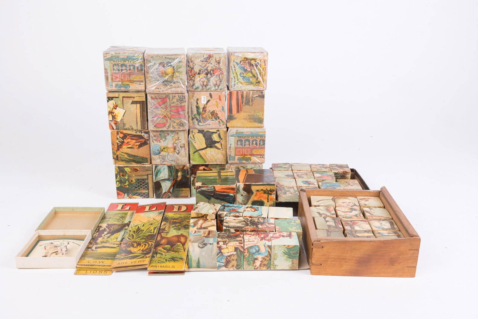 Lot of Victorian Block Games: Lot of Victorian Block Games Size 7" x 12" x 12" Literature Brooks Auction is not responsible for outbids. Questions? Call the office at (856) 694-2960 or email us directly at info@brooks.auction.