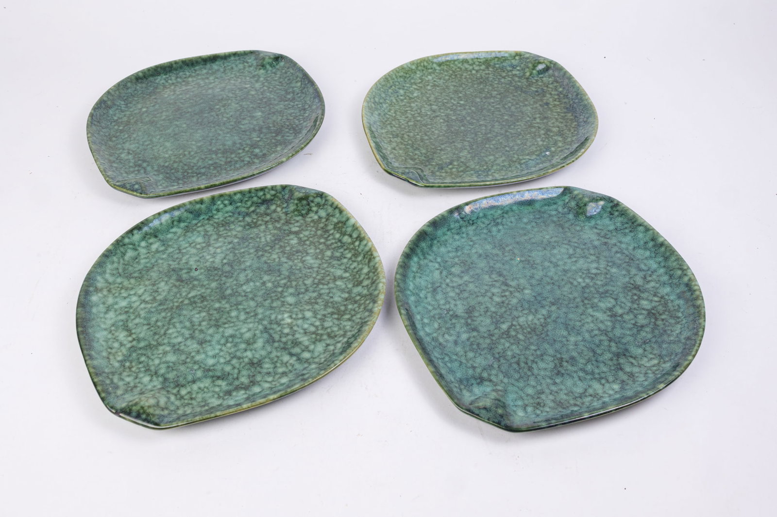 Four Roseville Raymor by Ben Seibel MCM Frogskin #152 Plates: (4) Roseville Raymor by Ben Seibel MCM Frogskin #152 Plates Size 12"W Literature Brooks Auction is not responsible for outbids. Questions? Call the office at (856) 694-2960 or email us directly at i