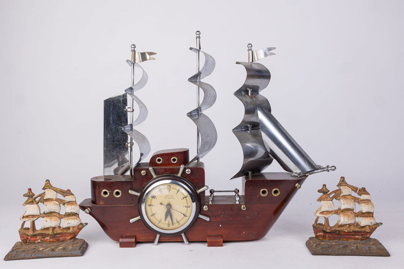 Tall Ship Decorative Assortment Lot: Tall Ship Decorative Assortment Lot: novelty tall ship clock with metal sails - pair of tall ship cast iron door stops Size 16" H Literature Brooks Auction is not responsible for outbids. Questions?