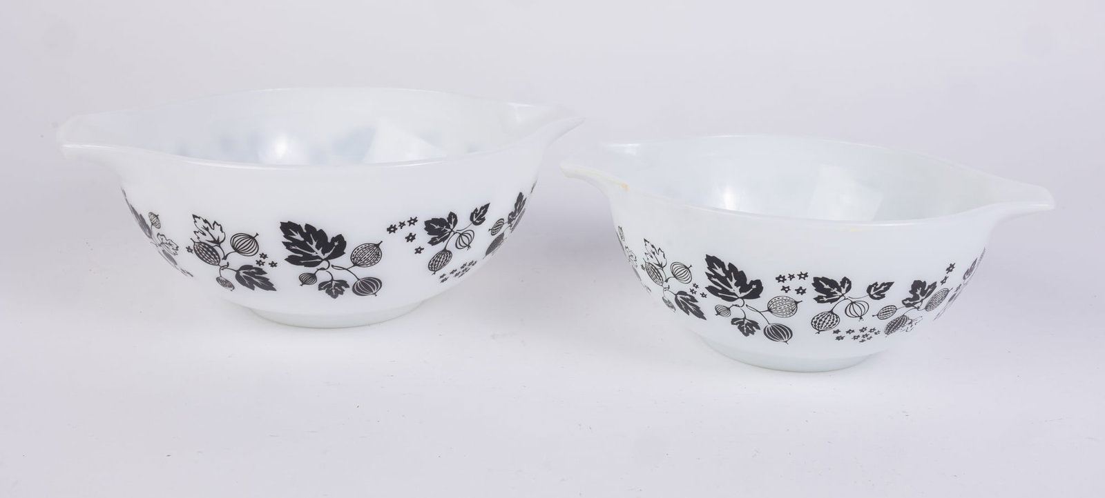 Two Pyrex Black Gooseberry Vintage Mixing Bowls: Two Pyrex Black Gooseberry Vintage Mixing Bowls Size 7" x 12" x 12" (box size) Literature Brooks Auction is not responsible for outbids. Questions? Call the office at (856) 694-2960 or email us dire