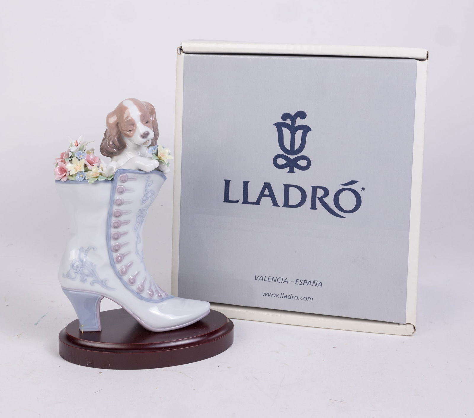 Lladro "A Well Heeled Puppy" Porcelain Figurine in Box: Lladro "A Well Heeled Puppy" Porcelain Figurine in Box Size 7" x 12" x 12" (box size) Literature Brooks Auction is not responsible for outbids. Questions? Call the office at (856) 694-2960 or email