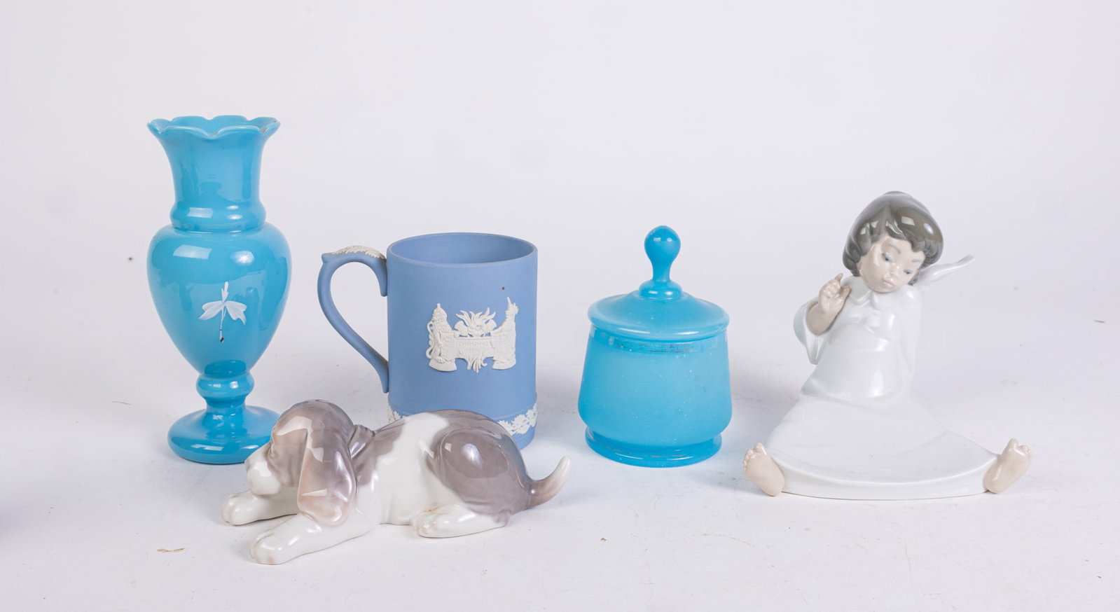 Decorative Glass and Porcelain Featuring Lladro: Decorative Glass and Porcelain Featuring Lladro: Lladro sleeping puppy - Lladro young angel porcelain figurine - blown glass vase - and more Size 7" x 12" x 12" (box size) Literature Brooks Auction is