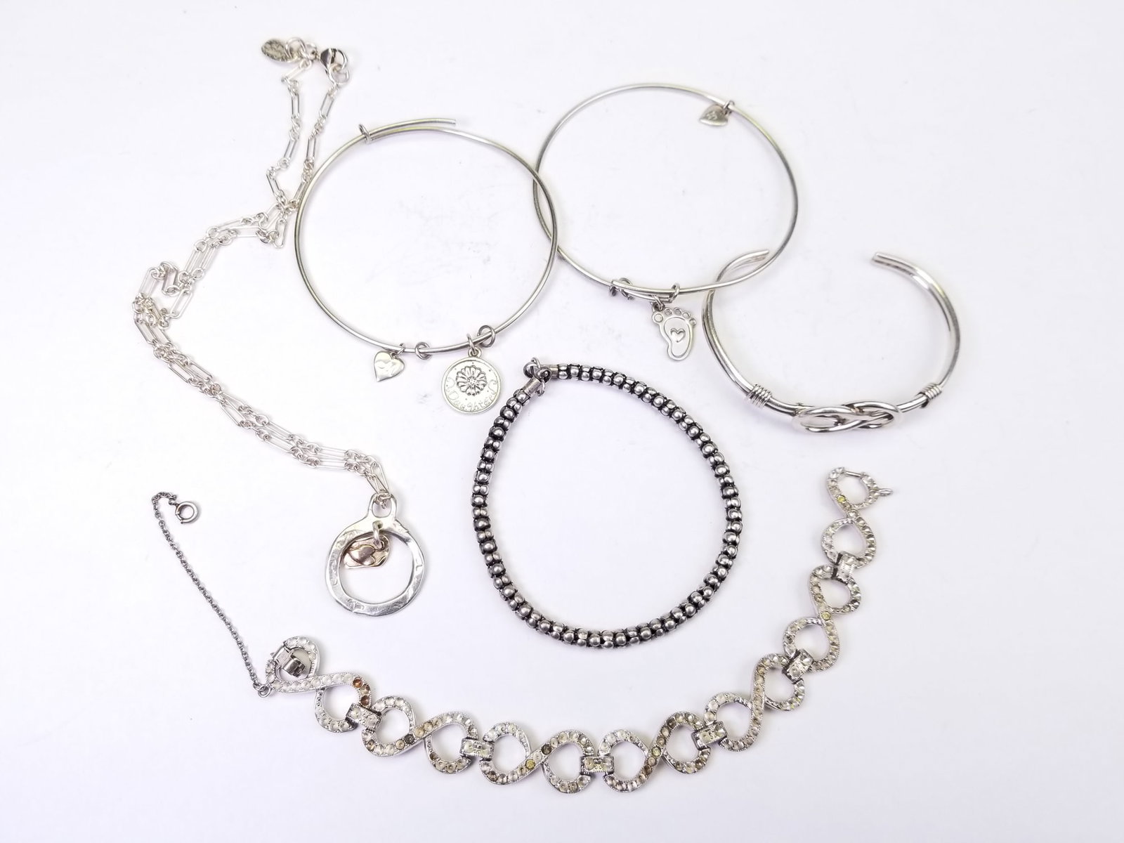 Sterling Silver Bracelets: Sterling Silver Bracelets, all bracelets marked 925 or sterling, total weight 77.3 grams Literature Brooks Auction is not responsible for outbids. Questions? Call the office at (856) 694-2960 or email