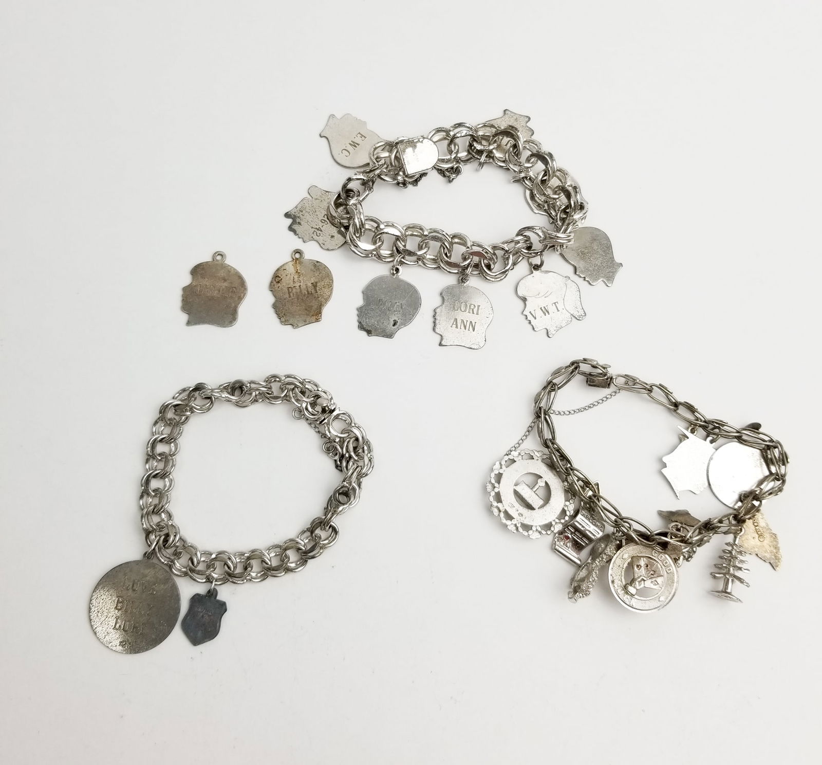 Sterling Silver Charm Bracelets: Sterling Silver Charm Bracelets, marked 925, total weight 125.2 grams Literature Brooks Auction is not responsible for outbids. Questions? Call the office at (856) 694-2960 or email us directly at in