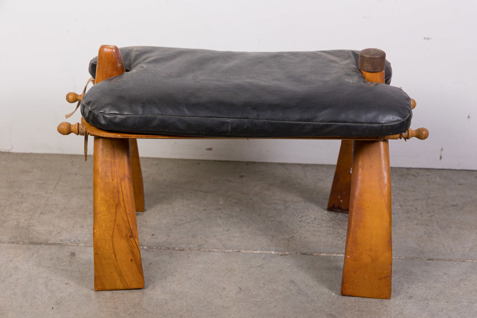 Vintage Black Leather Camel Saddle Ottoman (1 of 5)