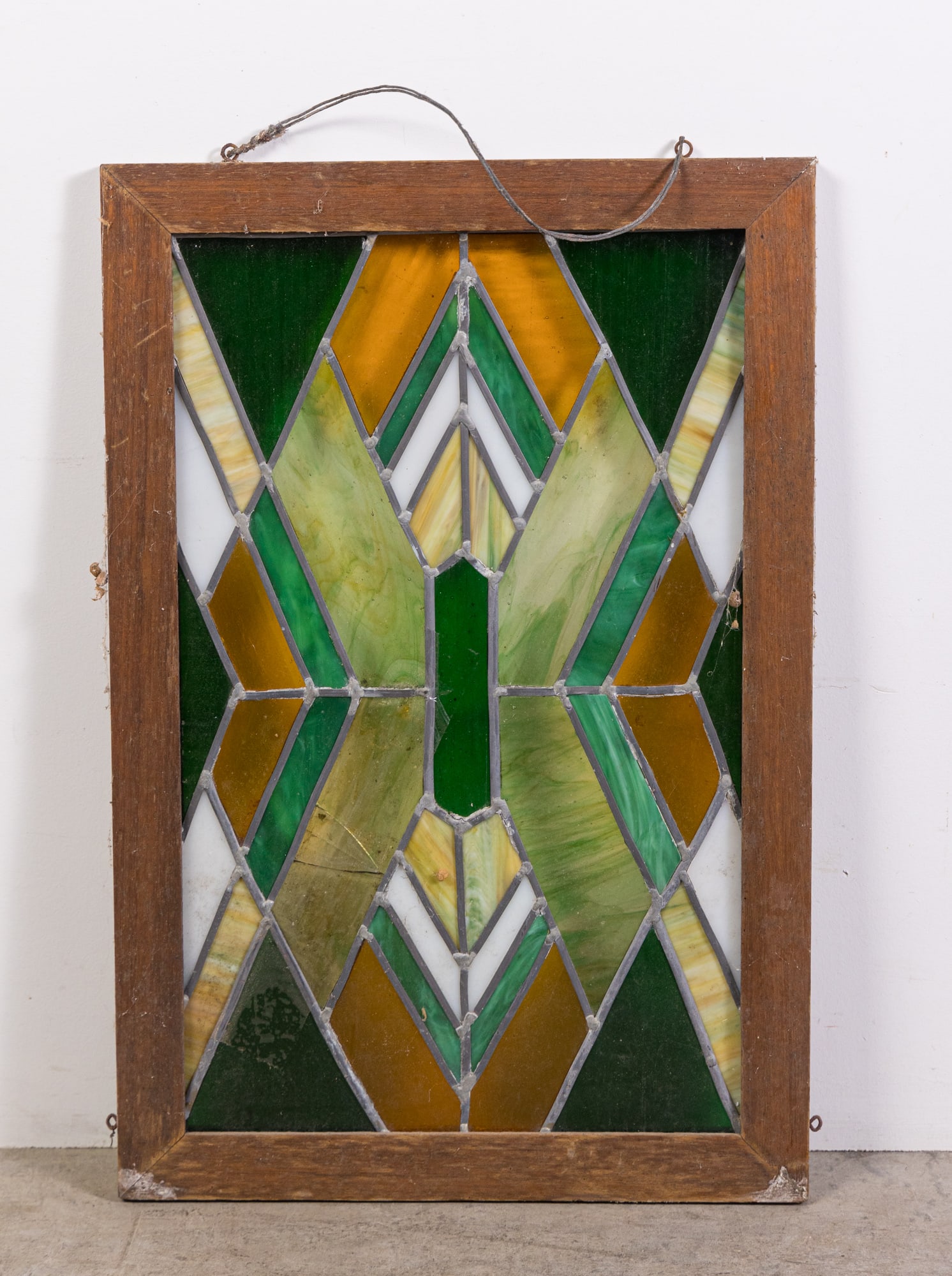 Vintage Leaded Stained Glass Window Panel: Vintage Leaded Stained Glass Window Panel, wood frame, multi colored design. crack in one panel Size 25" x 17" Literature Brooks Auction is not responsible for outbids. Questions? Call the office at