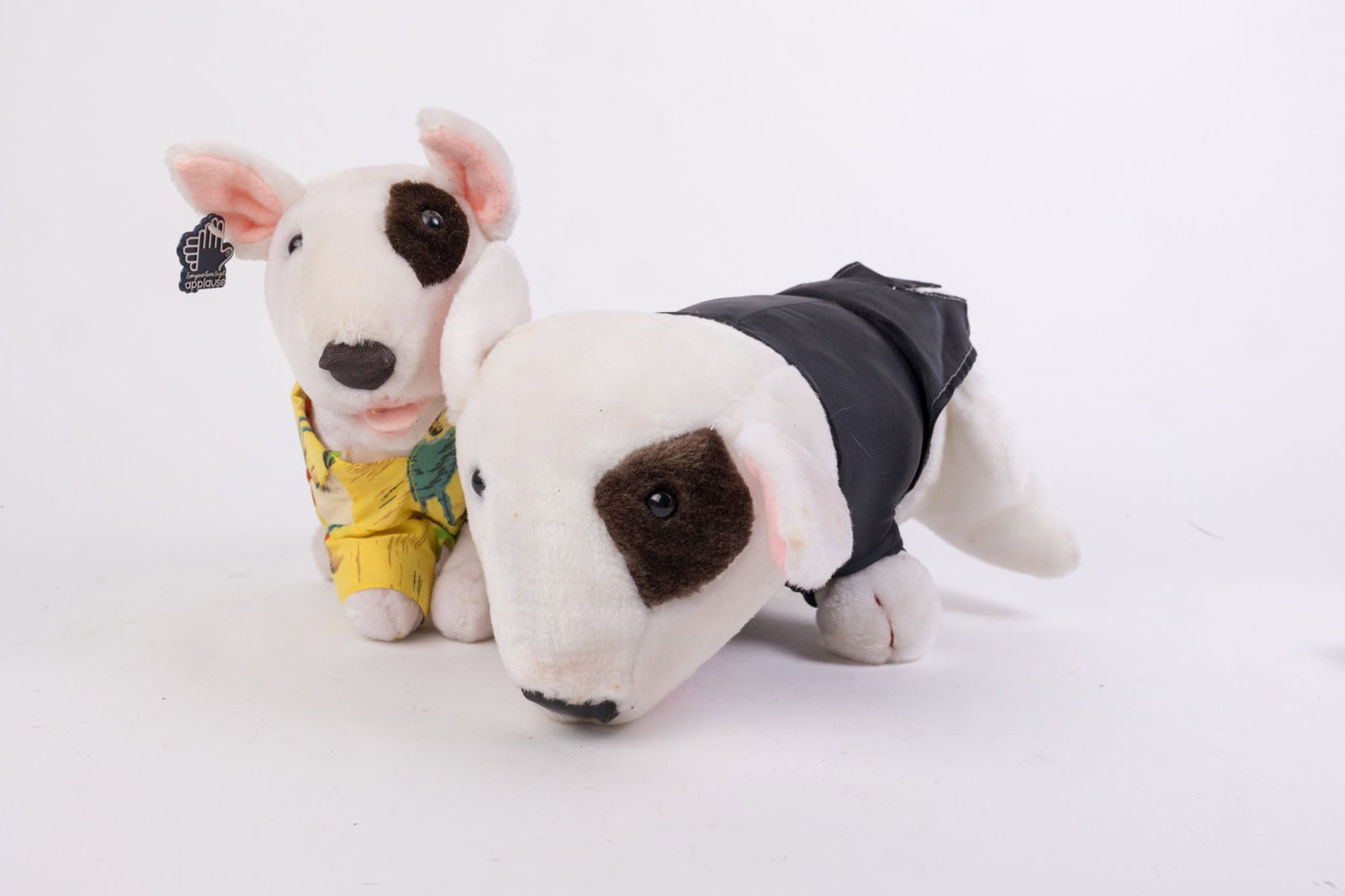 Two Vintage Spuds Mackenzie Plush Toys: Two Vintage Spuds Mackenzie Plush Toys: Tuxedo Spuds Mackenzie plush toy - Hawaiian Spuds Mackenzie plush toy Size 7" x 12" x 12" (box size) Literature Brooks Auction is not responsible for outbids.