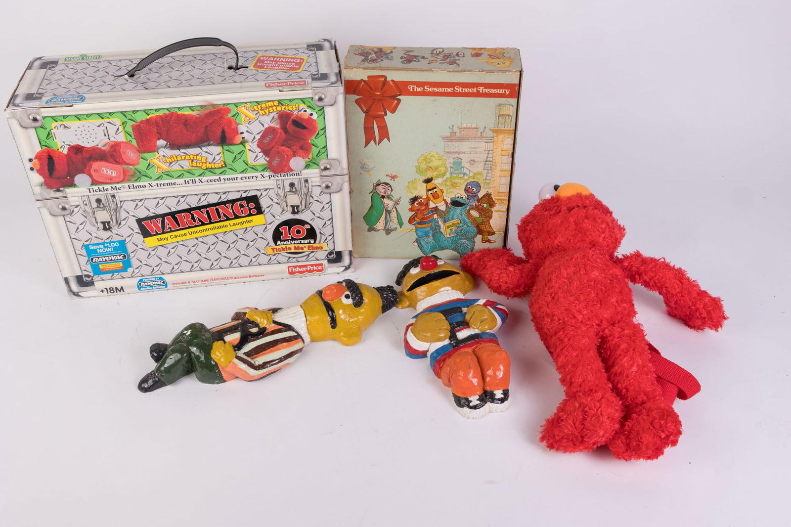 Sesame Street Toys and Decor: Sesame Street Toys and Decor: Sesame Street Tickle Me Elmo 10th Anniversary edition - elmo backpack - Bert and Ernie Chalkware wall decor - and more Size 7" x 12" x 12" (box size) Literature Brooks A