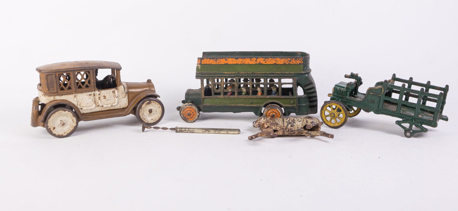 Assorted Cast Iron Vehicles: Assorted Cast Iron Vehicles: cast iron double decker bus - 2 Arcade cast iron car made in USA - and more Size 7" x 12" x 12" (box size) Literature Brooks Auction is not responsible for outbids. Ques