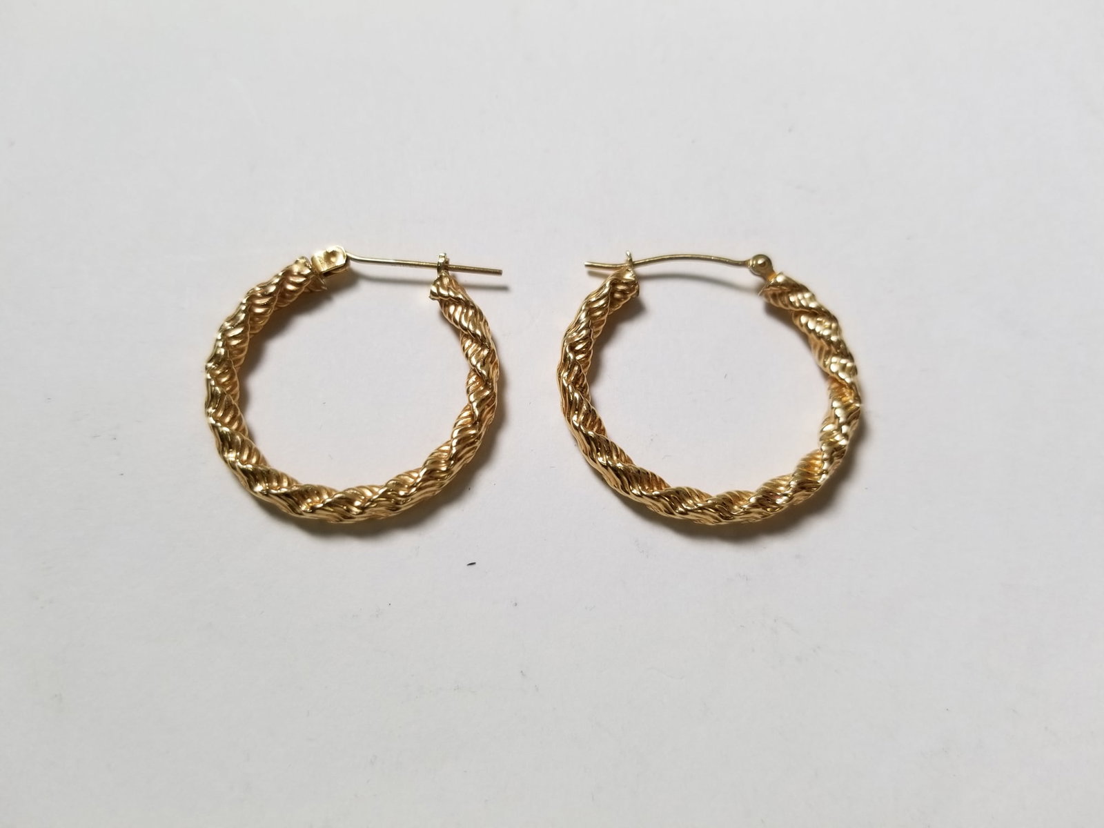 Pair of 14KY Gold Hoops: Pair of 14KY Gold Hoops, marked 14K, untested, total weight 1.8 grams Literature Brooks Auction is not responsible for outbids. Questions? Call the office at (856) 694-2960 or email us directly at inf
