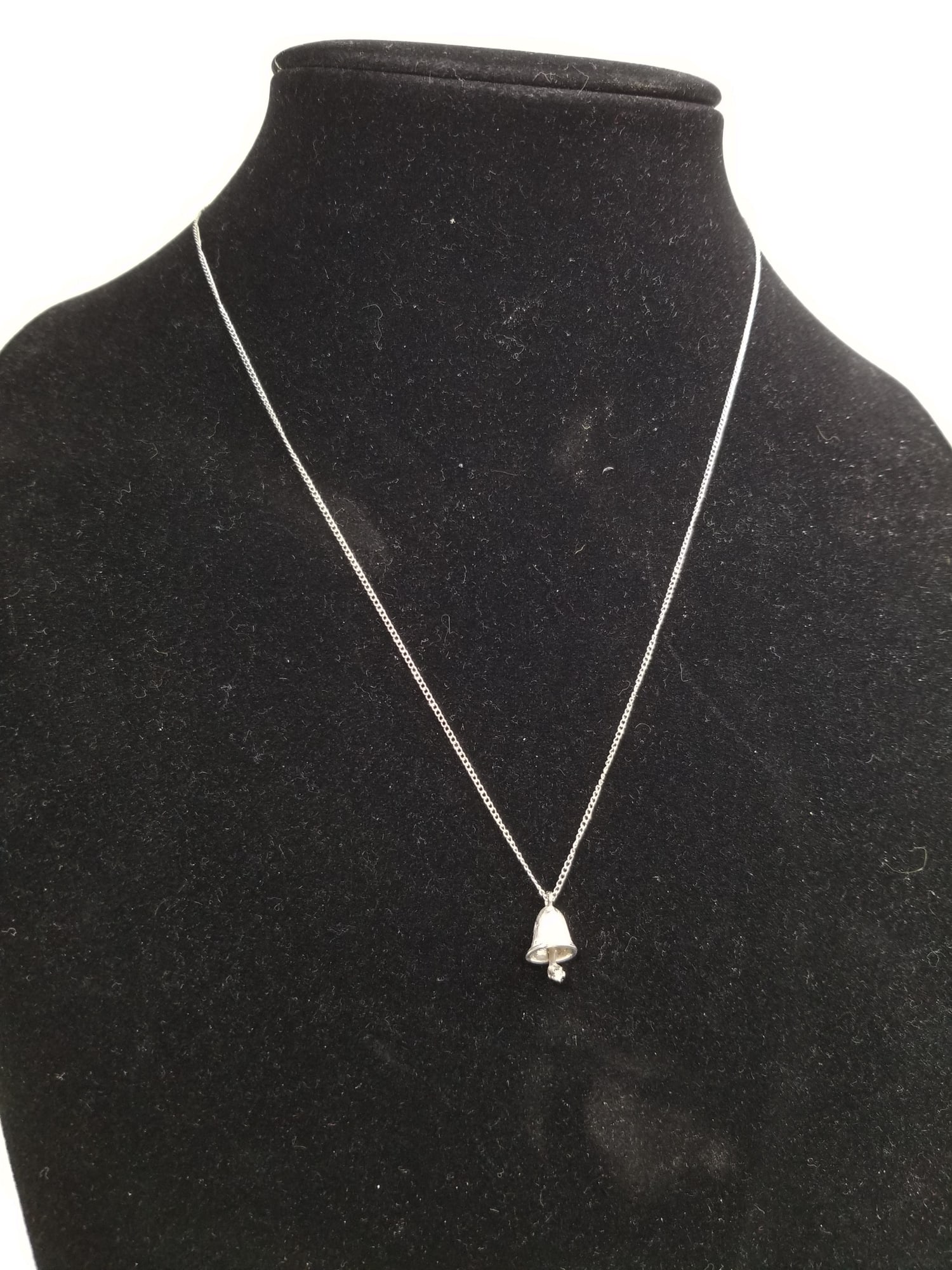 14KW Gold Bell Necklace: 14KW Gold Bell Necklace, marked 14K, untested, total weight 2.0 grams, knot near clasp Literature Brooks Auction is not responsible for outbids. Questions? Call the office at (856) 694-2960 or email u