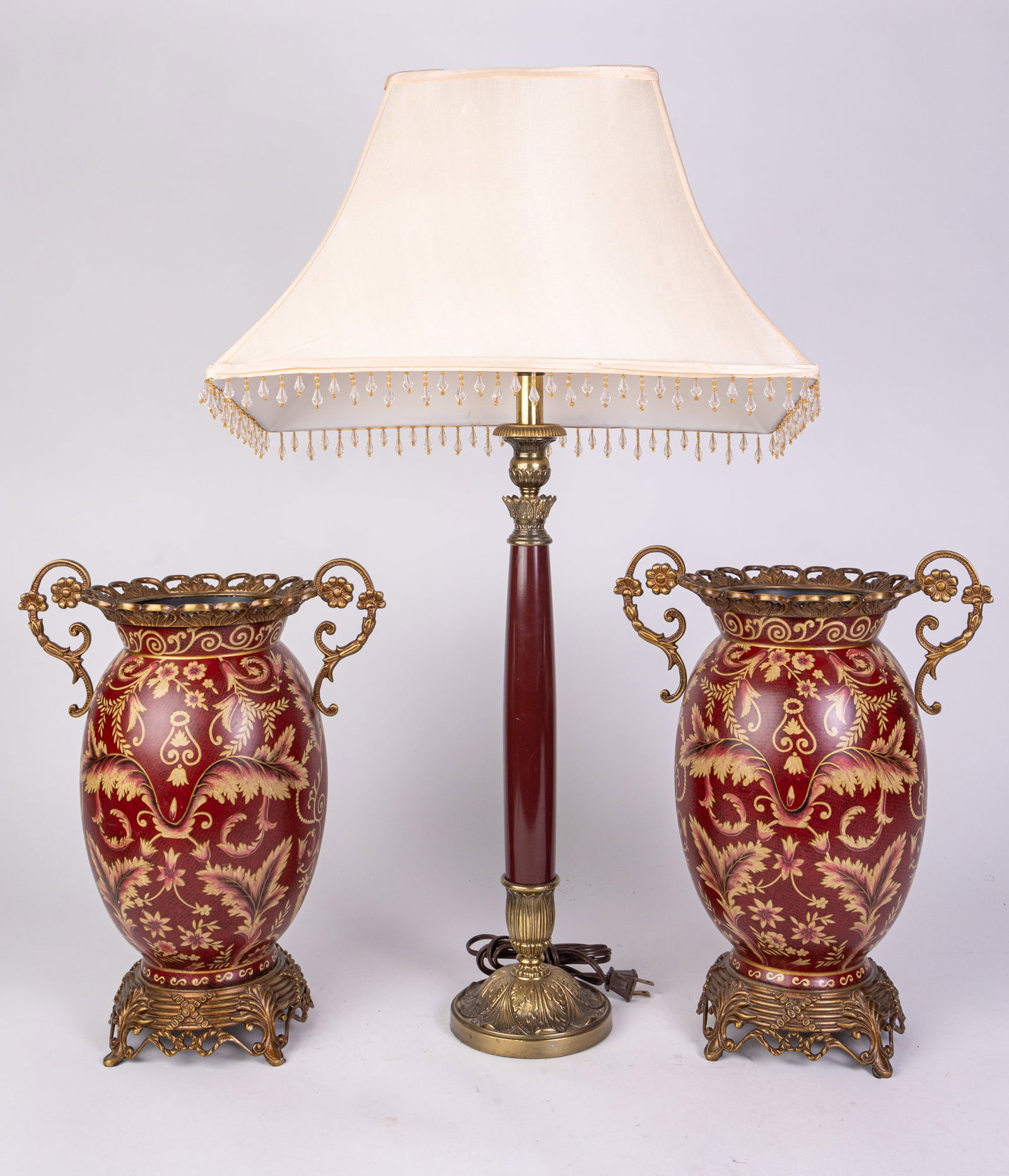 Pair of Burgundy and Gold Decorative Vessels with Lamp: Pair of Burgundy and Gold Decorative Vessels with Lamp Size 29" H Literature Brooks Auction is not responsible for outbids. Questions? Call the office at (856) 694-2960 or email us directly at info@