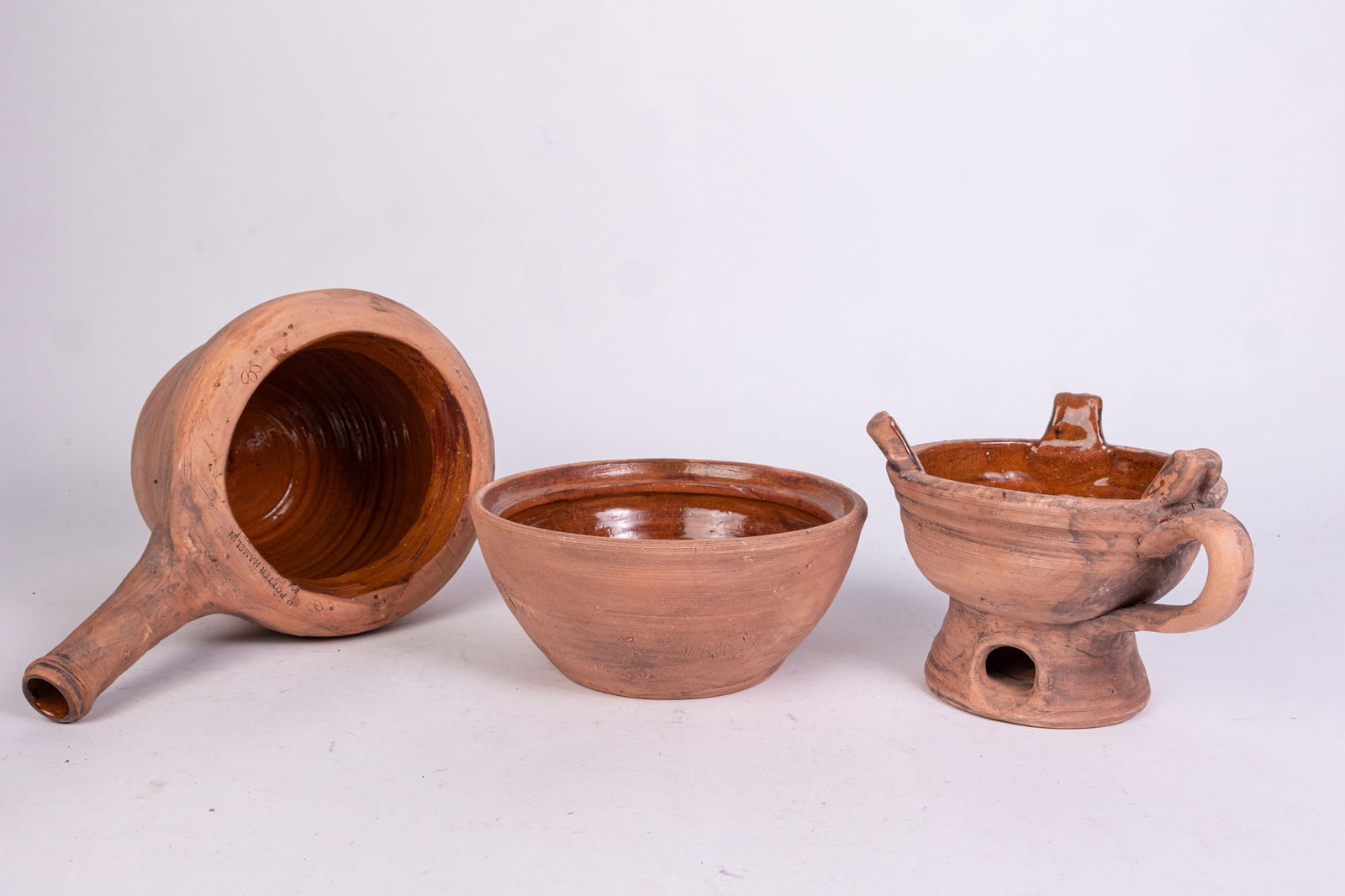 Three Pieces of Redware by Pied Piper Hamelin: Three Pieces of Redware by Pied Piper Hamelin Size 7" x 12" x 12" Literature Brooks Auction is not responsible for outbids. Questions? Call the office at (856) 694-2960 or email us directly at info@