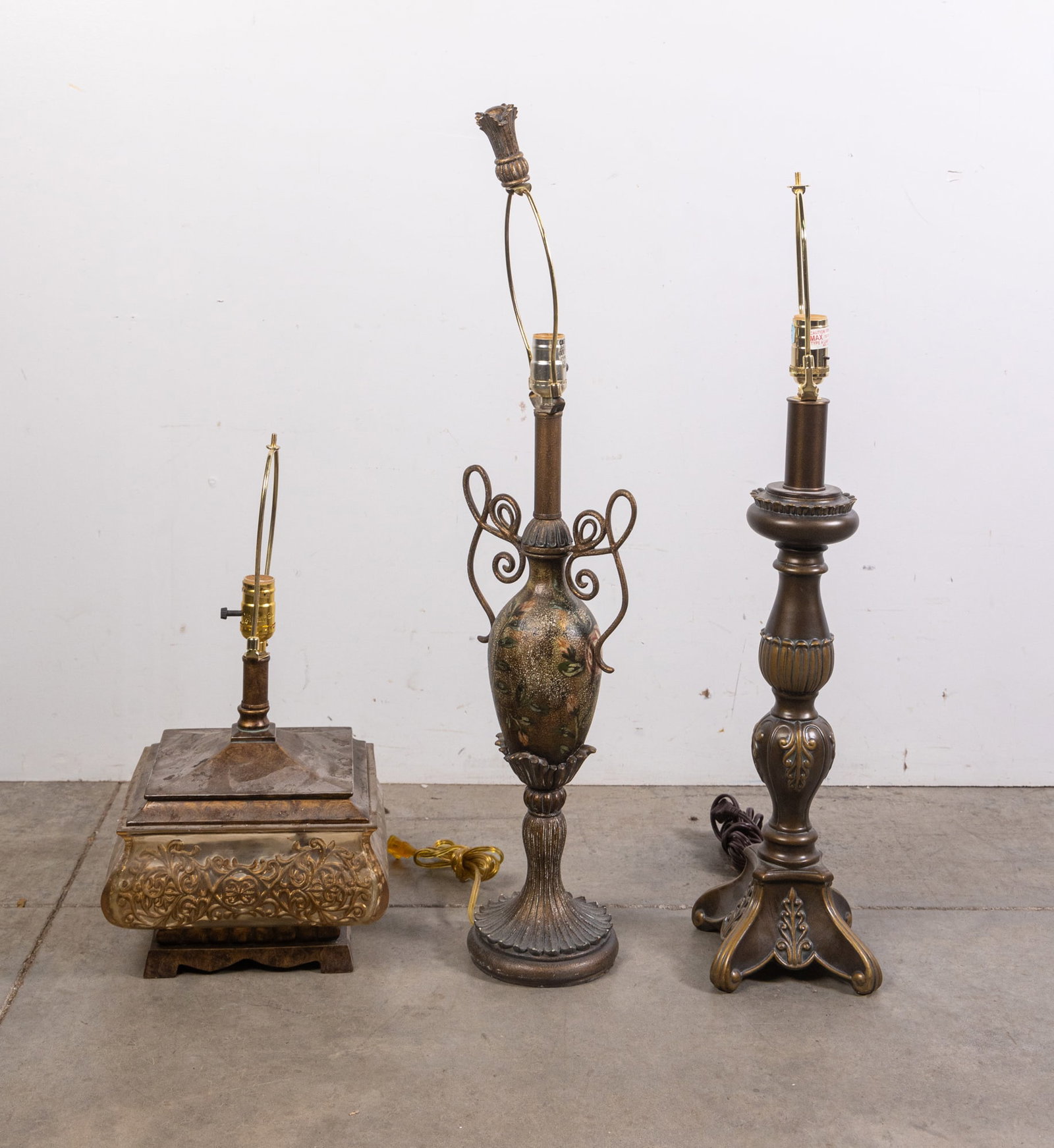 Three Ornate Table Lamps: Three Ornate Table Lamps Size 33" H Literature Brooks Auction is not responsible for outbids. Questions? Call the office at (856) 694-2960 or email us directly at info@brooks.auction. •
