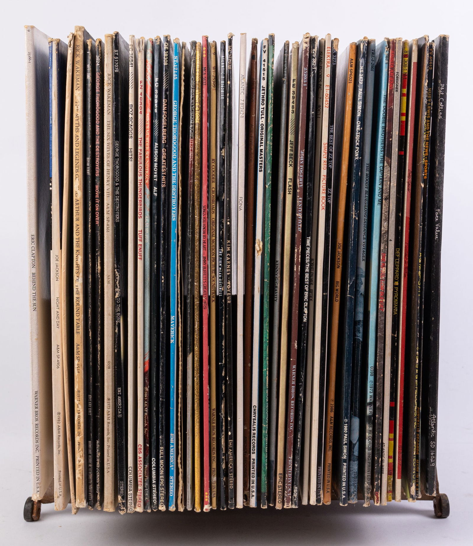 MCM Vinyl Rack w/ Records Featuring Phil Collins & Eric Clapton: MCM Vinyl Rack w/ Records Featuring Phil Collins & Eric Clapton Literature Brooks Auction is not responsible for outbids. Questions? Call the office at (856) 694-2960 or email us directly at info@bro