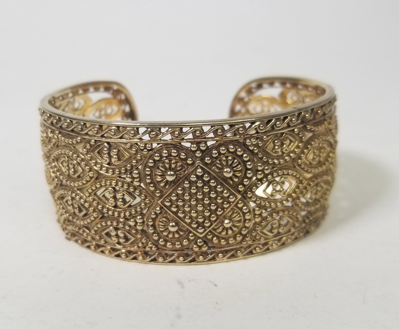 Gold Tone Sterling Silver Cuff: Gold Tone Sterling Silver Cuff, marked 925, total weight 42.6 grams Literature Brooks Auction is not responsible for outbids. Questions? Call the office at (856) 694-2960 or email us directly at info@