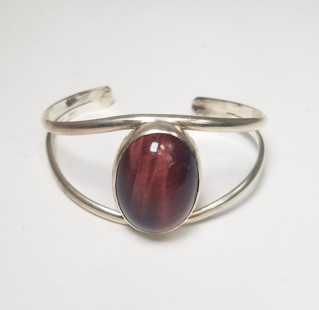 Sterling Silver Cuff: Sterling Silver Cuff, signed AK, marked Sterling, total weight 18.2 grams Literature Brooks Auction is not responsible for outbids. Questions? Call the office at (856) 694-2960 or email us directly at