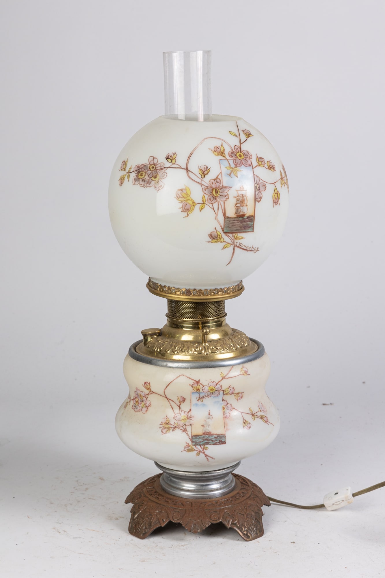 Gone with the Wind Lamp with Hand Painted Tall Ship Scene: Gone with the Wind Lamp with Hand Painted Tall Ship Scene, hand painted tall ship scene on both base and globe with floral accents, signed E. Donaghay, tested and top works Size 21" Literature Brooks