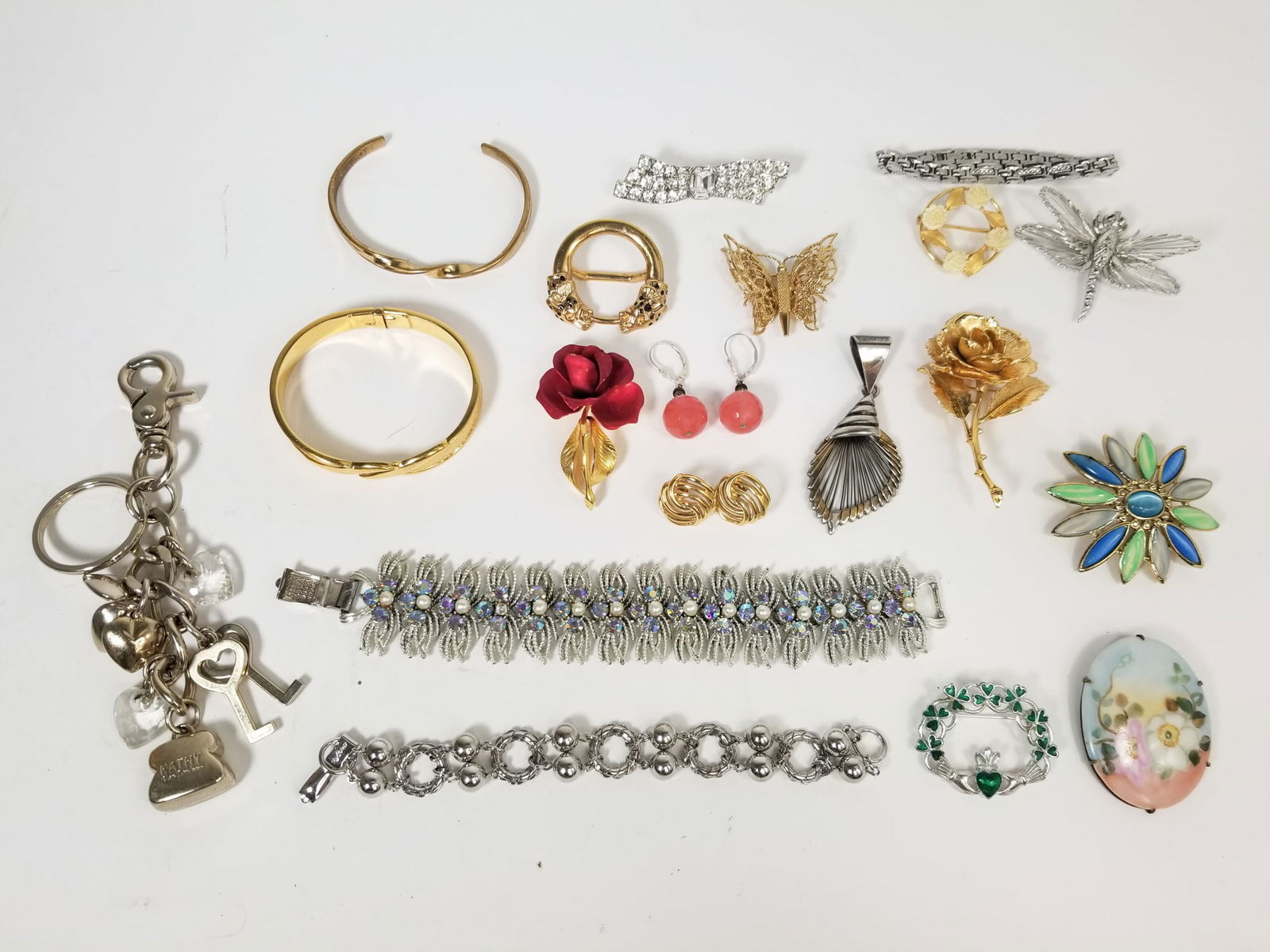 Marked Costume Jewelry and Assorted Brooches: Marked Costume Jewelry and Assorted Brooches, name brands include: Best, Coro, Cerrito, Sergio Lub, Monet, Kathy Ver Zeeland, West Germany, Citizen Literature Brooks Auction is not responsible for ou