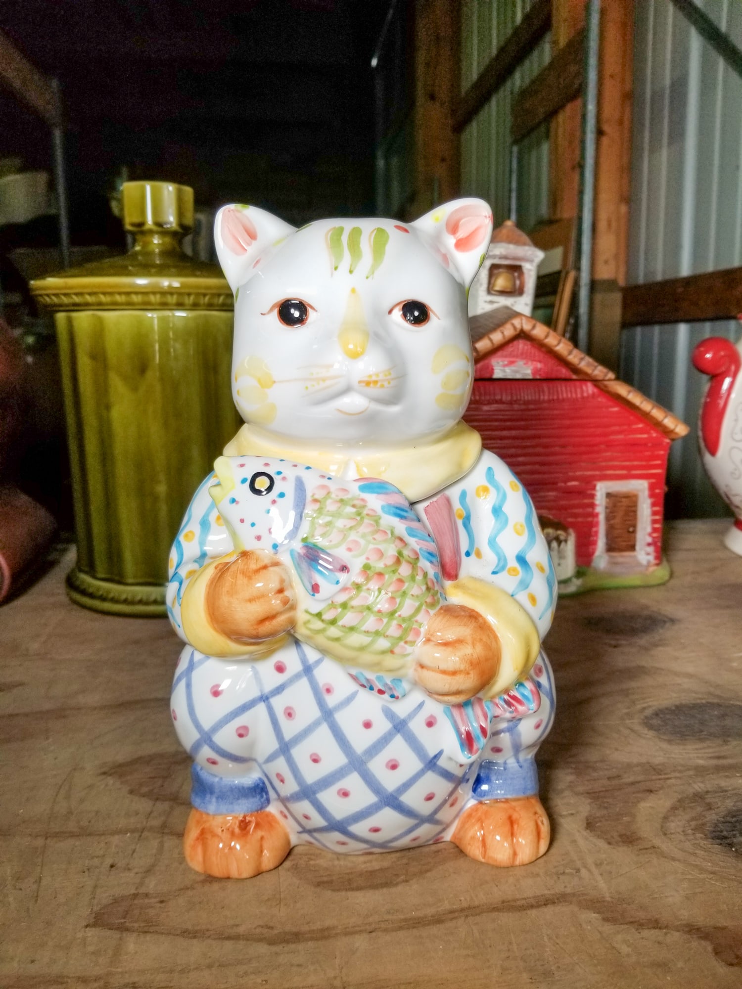 Cat Holding a Fish Cookie Jar: Cat Holding a Fish Cookie Jar Size 9.5" Literature Brooks Auction is not responsible for outbids. Questions? Call the office at (856) 694-2960 or email us directly at info@brooks.auction. 