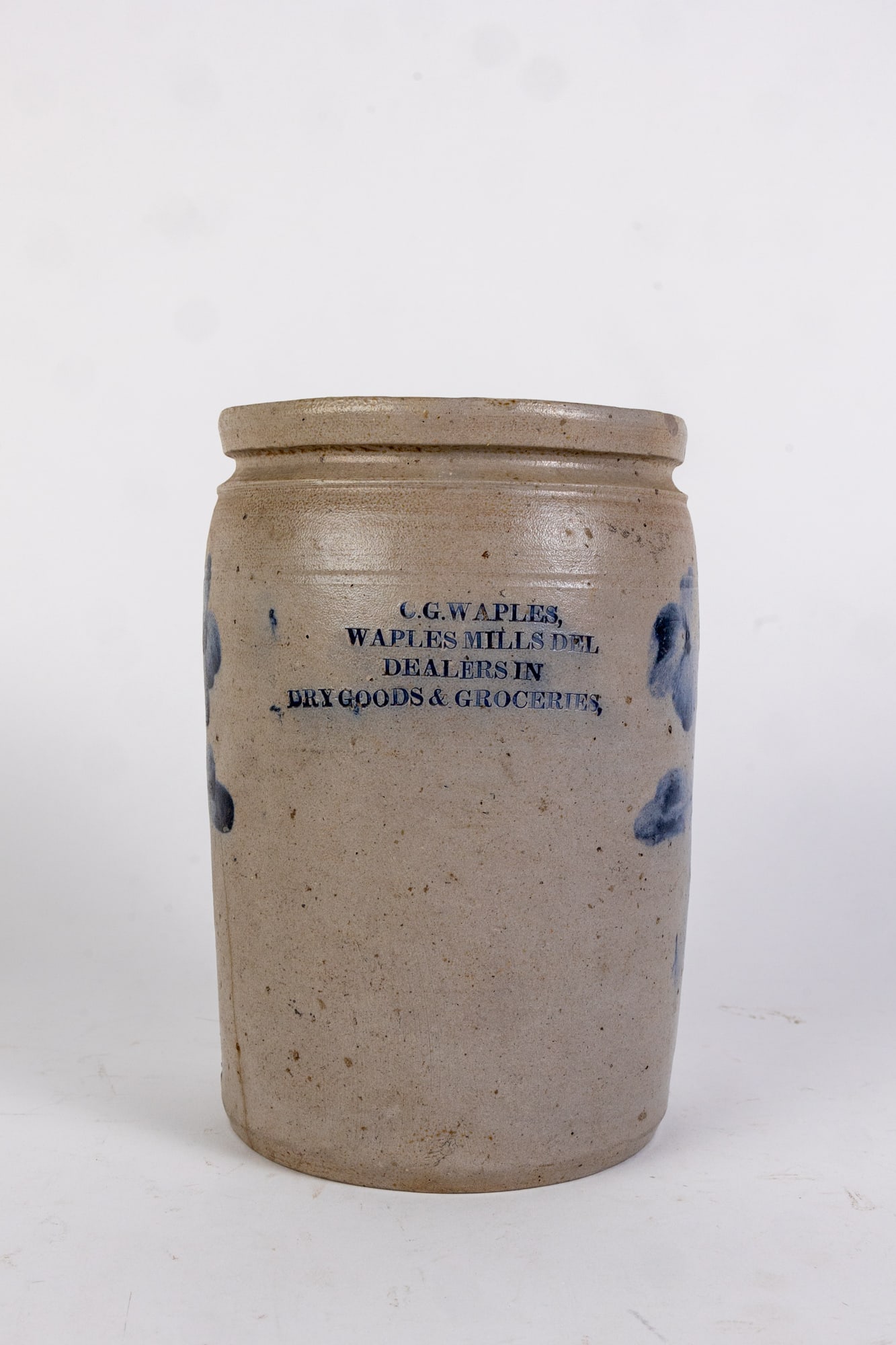 C.G. Waples, Waples Mills Del Stoneware Crock with Cobalt Decoration: C.G. Waples, Waples Mills Del Stoneware Crock with Cobalt Decoration, stoneware one gallon crock with cobalt floral decoration, stamped "C.G. Waples, Waples Mills Del, Dealers in Dry Goods & Groceries