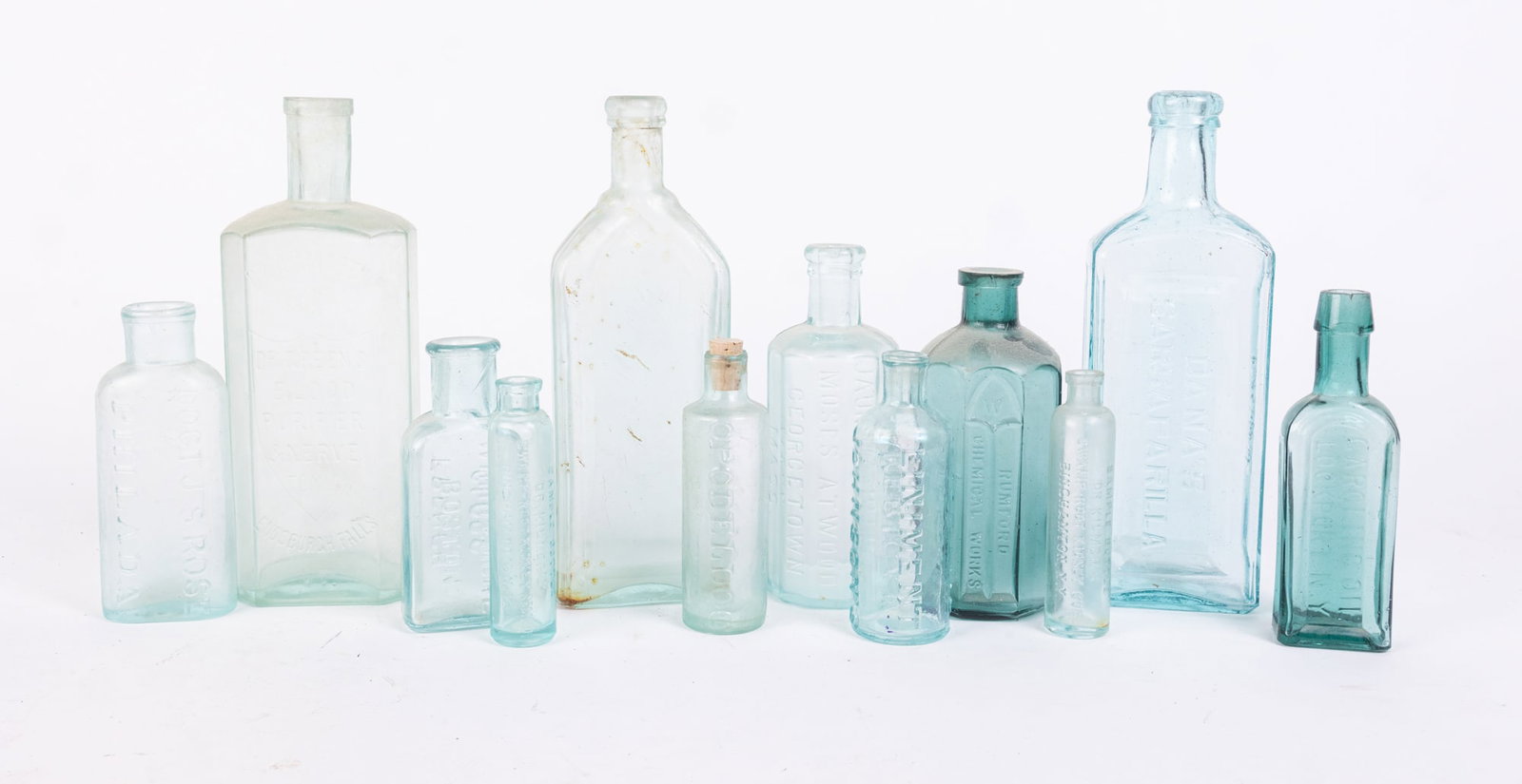 Lot of Antique Aqua Apothecary Glass Bottles: Lot of Antique Aqua Apothecary Glass Bottles: Dr. C.S. Green & Co. Blood Purifier - Gargling Oil Lockport NY - Rev I.R. Gates Macamoose - Whitmore Boston French Gloss - Doct. J.S. Rose Hair Tonic - Jo