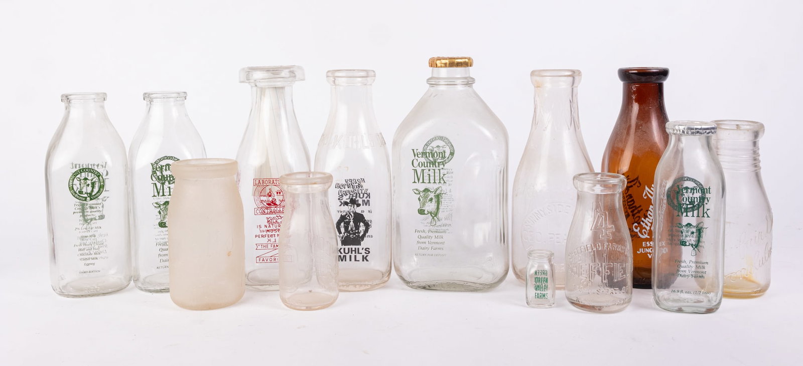 Lot of Vintage Glass Milk Bottles: Lot of Vintage Glass Milk Bottles Size 7" x 12" x 12" (box size) Literature Brooks Auction is not responsible for outbids. Questions? Call the office at (856) 694-2960 or email us directly at info@b