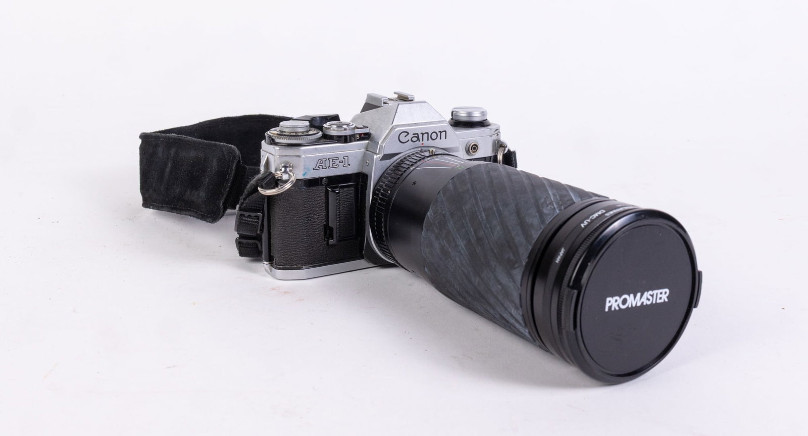 Canon AE-1 Vintage Camera: Canon AE-1 Vintage Camera, tested and does not fire. jammed in some way Size 4" H Literature Brooks Auction is not responsible for outbids. Questions? Call the office at (856) 694-2960 or email us d
