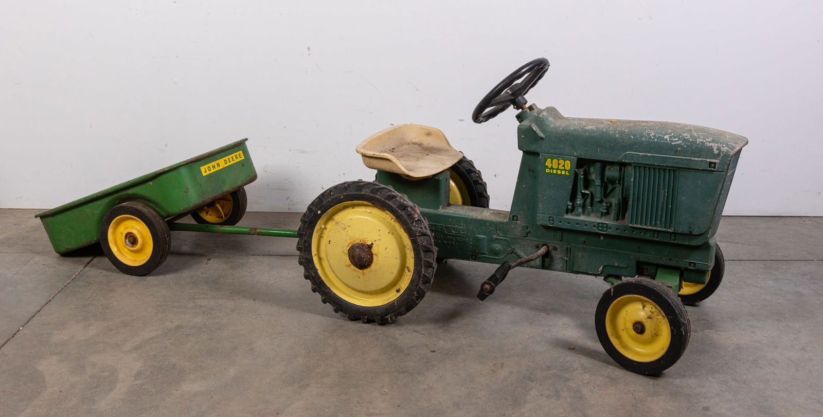 John Deere 4020 Ertl Pedal Tractor with Cart: John Deere 4020 Ertl Pedal Tractor with Cart Size 22" x 35" x 16" Literature Brooks Auction is not responsible for outbids. Questions? Call the office at (856) 694-2960 or email us directly at info@